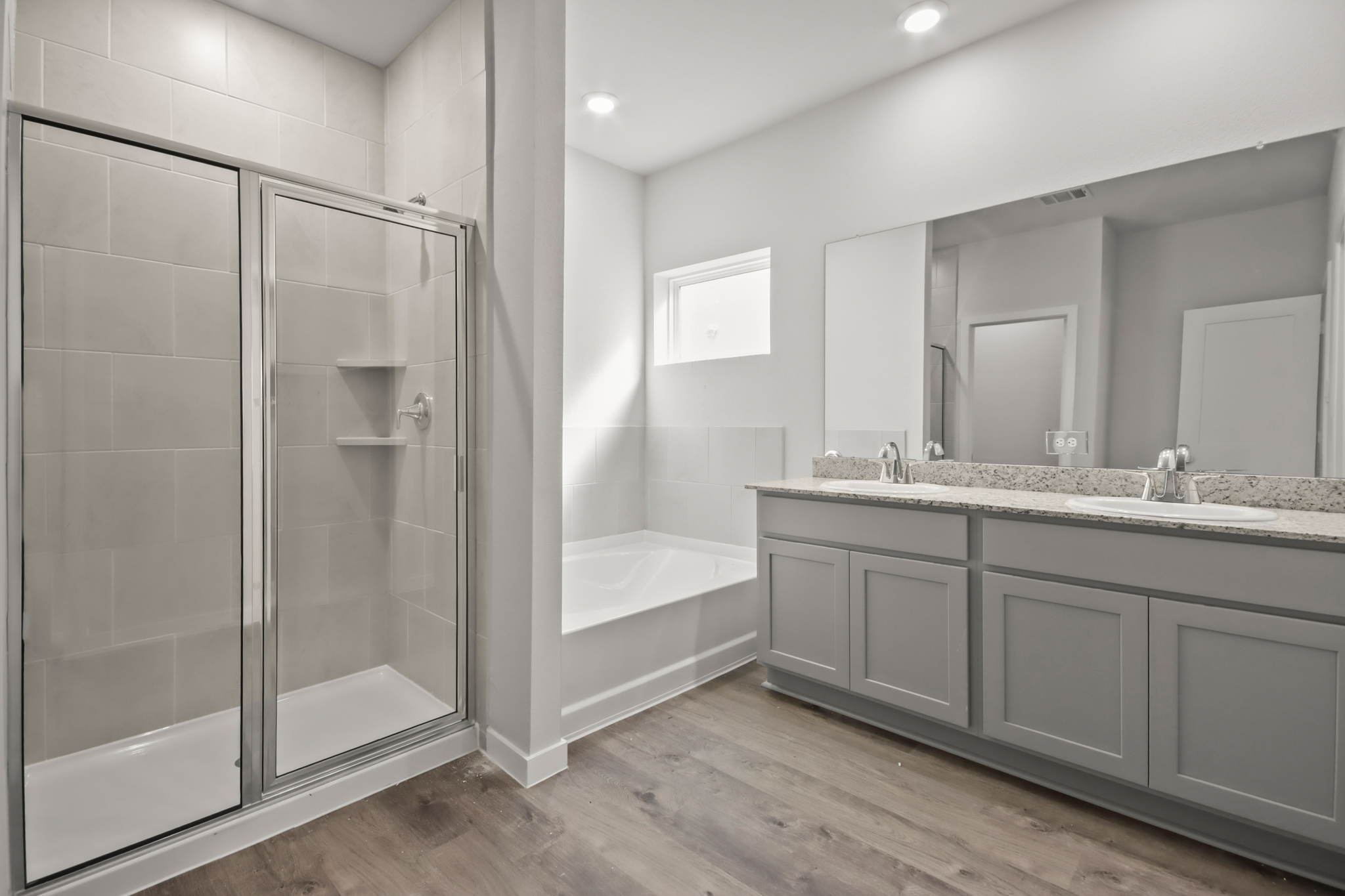 A bathroom with a glass shower.
