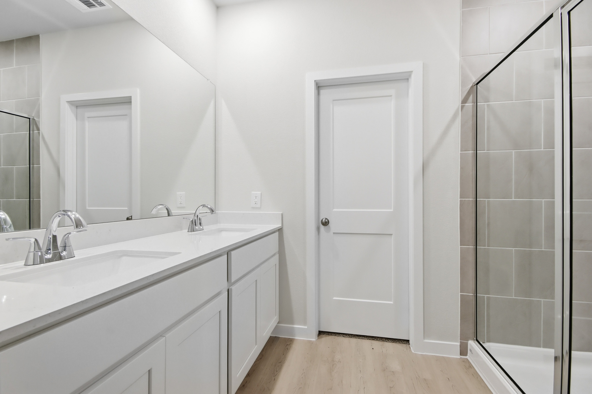 A bathroom with a glass shower.