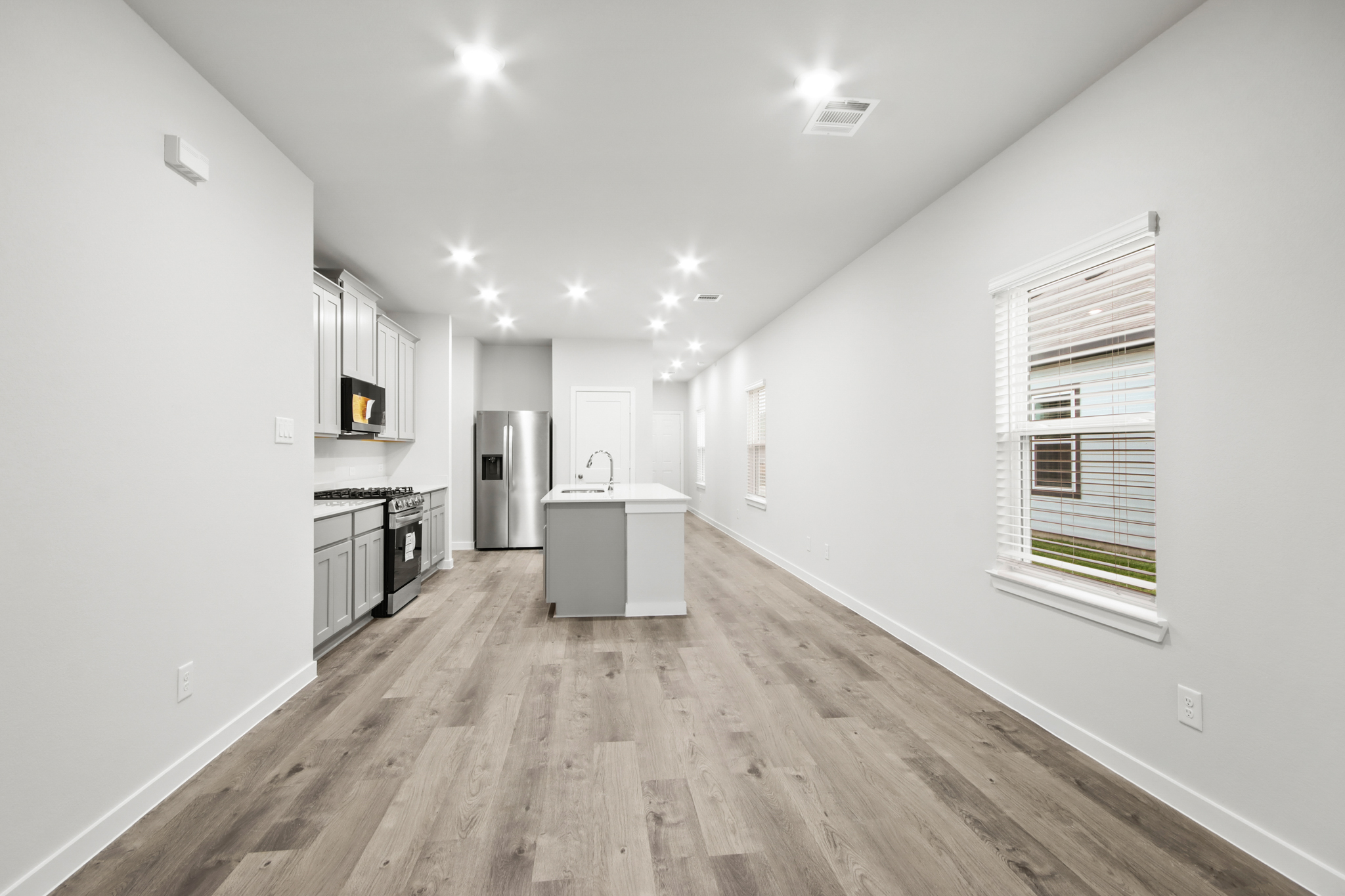 A kitchen with white walls.