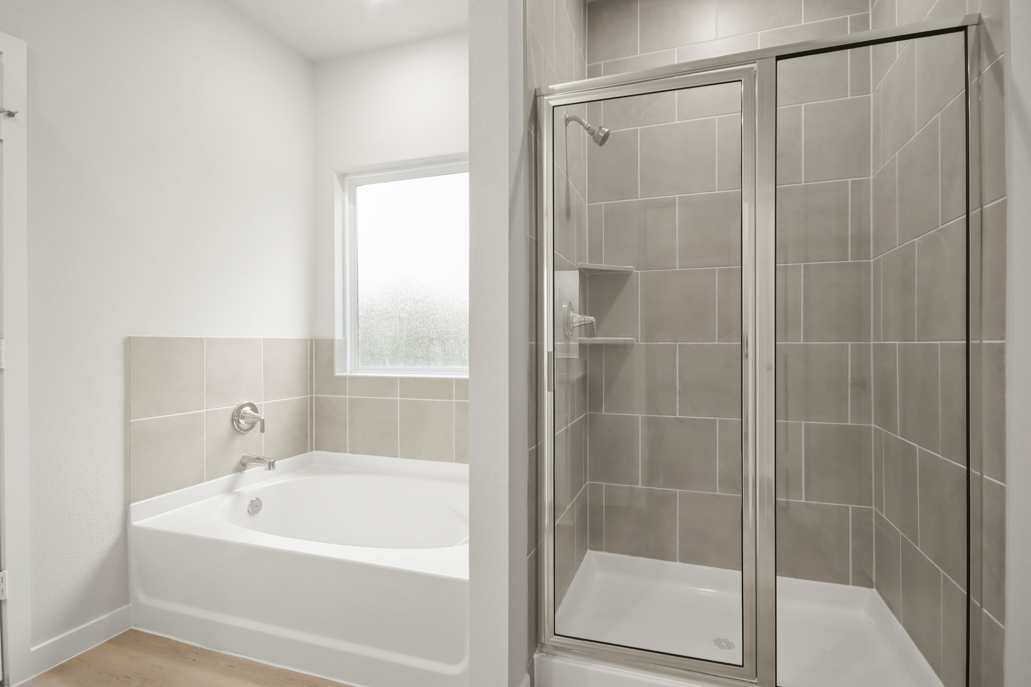 A bathroom with a glass shower.