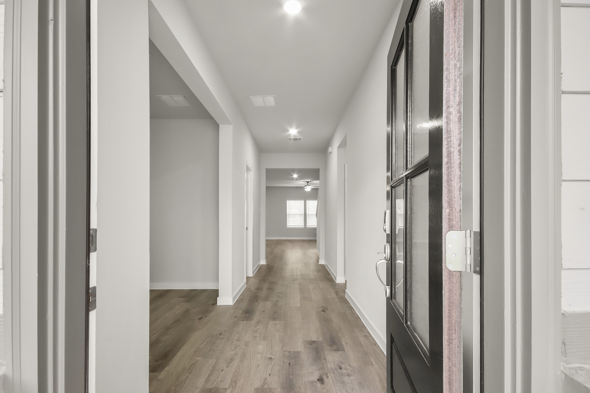 A hallway with white walls.