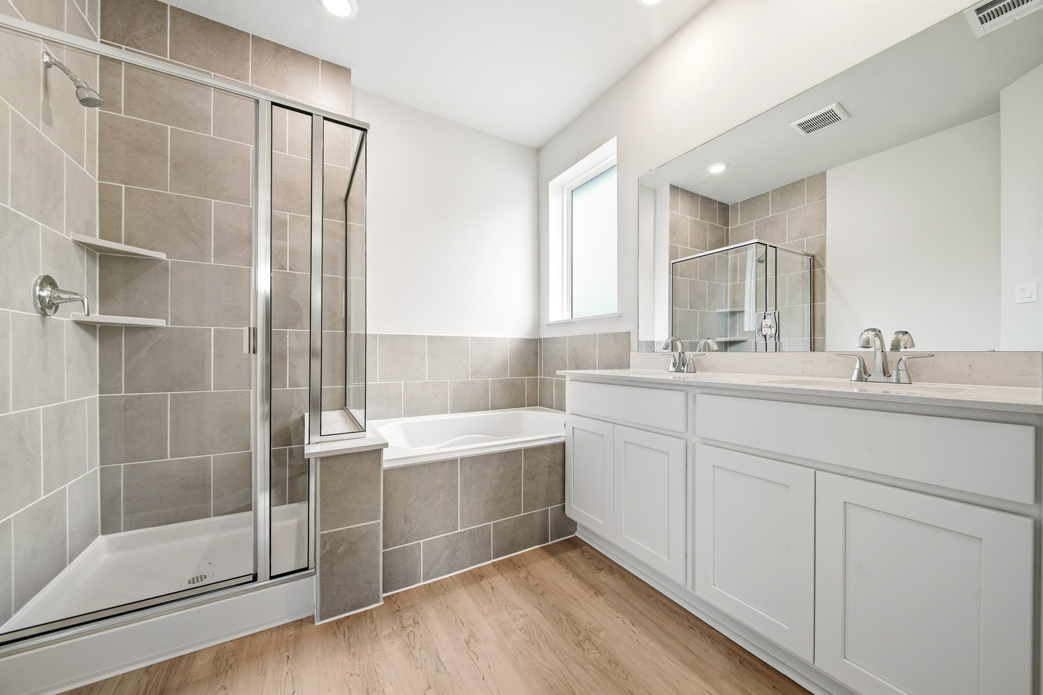 A bathroom with a glass shower.