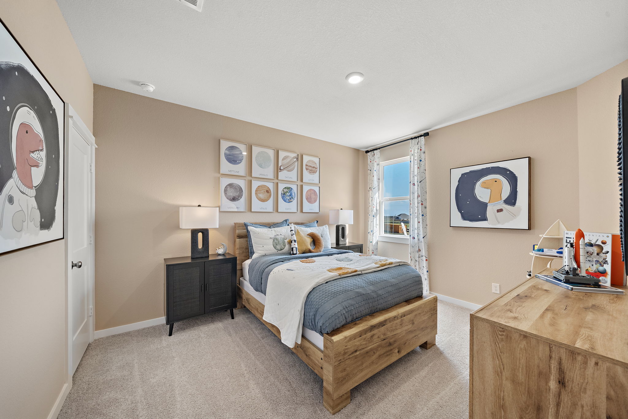 A bedroom with a bed and a bench.