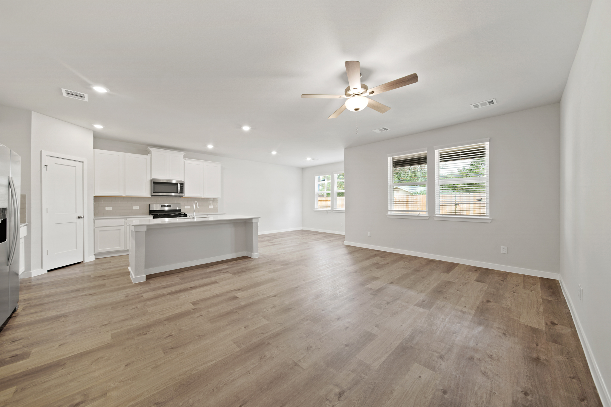 A large kitchen with white cabinets.