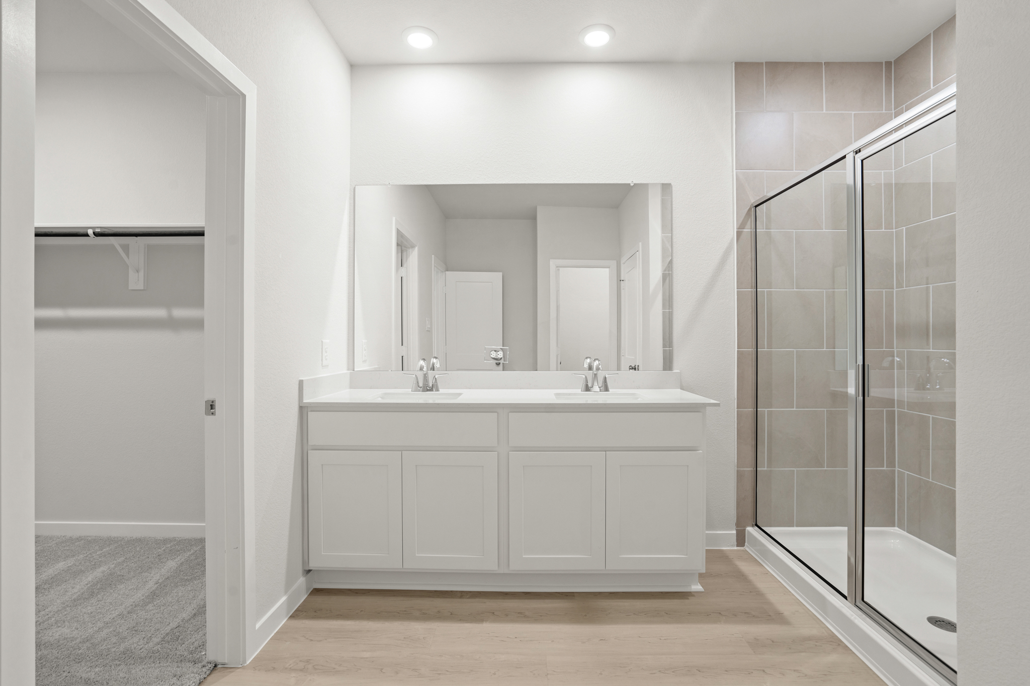 A bathroom with a glass shower.