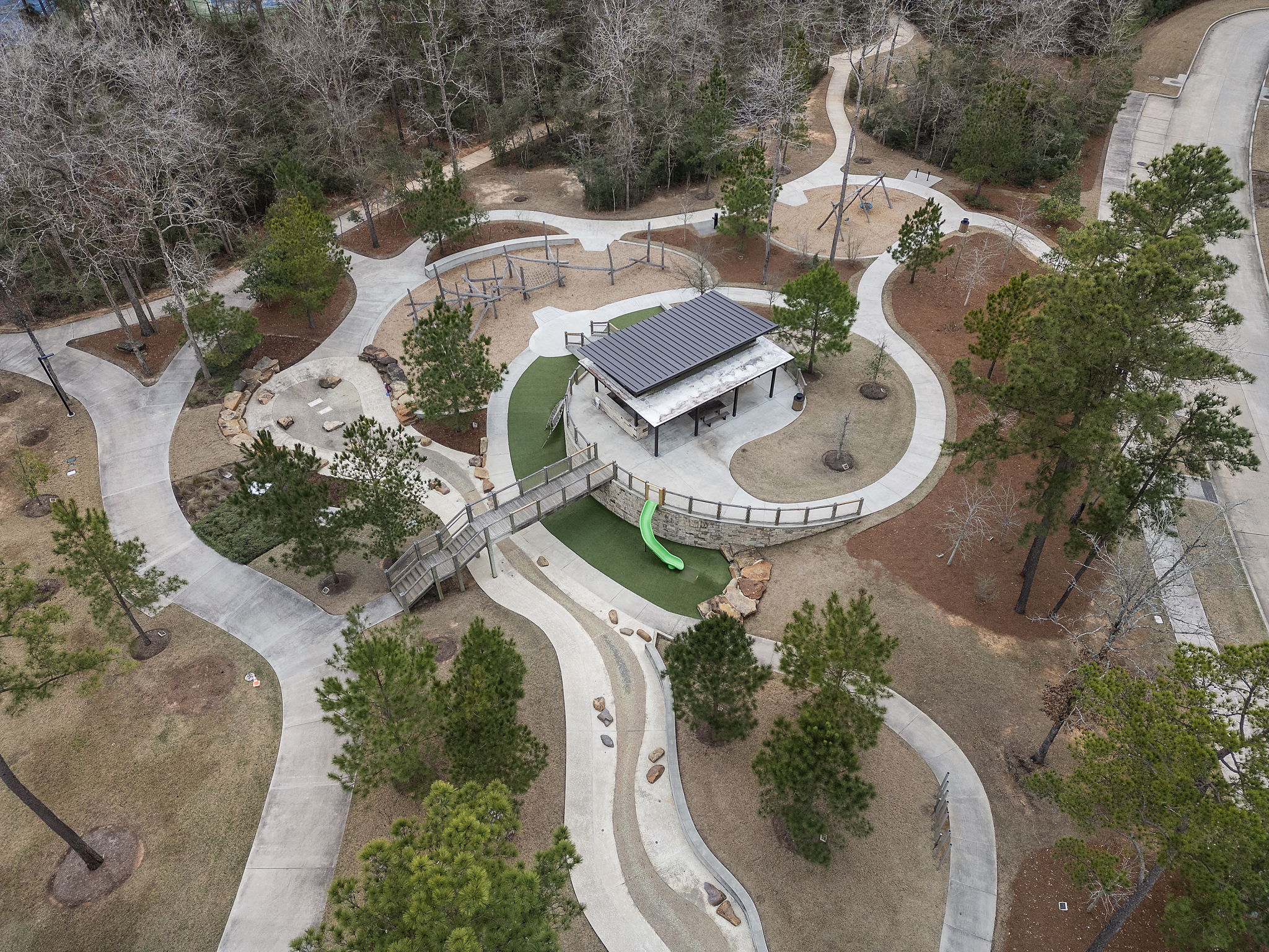 A building with a courtyard and trees around it.