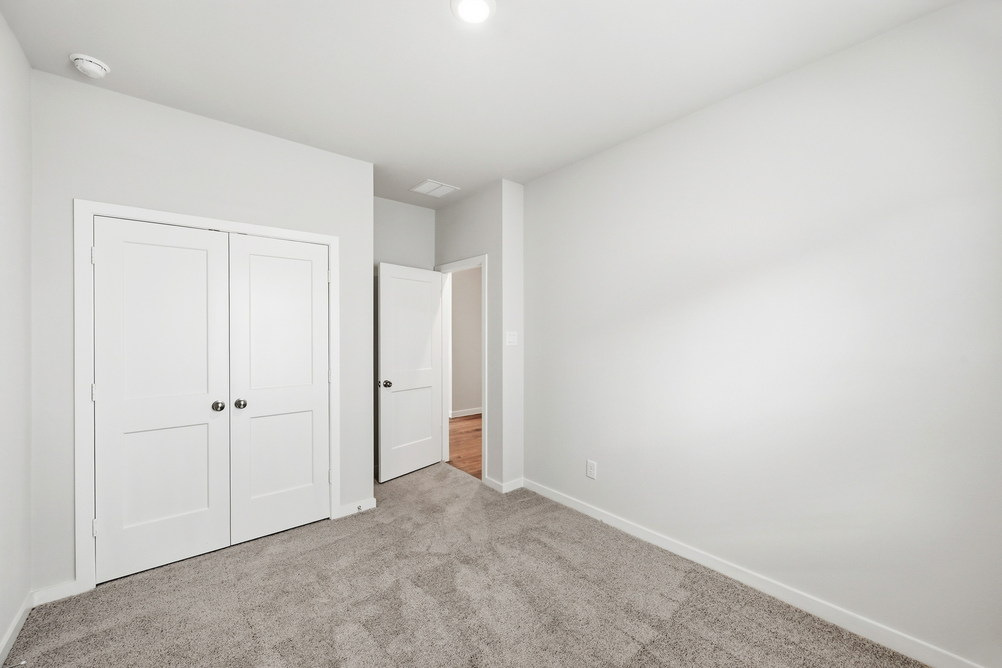 A room with white doors.