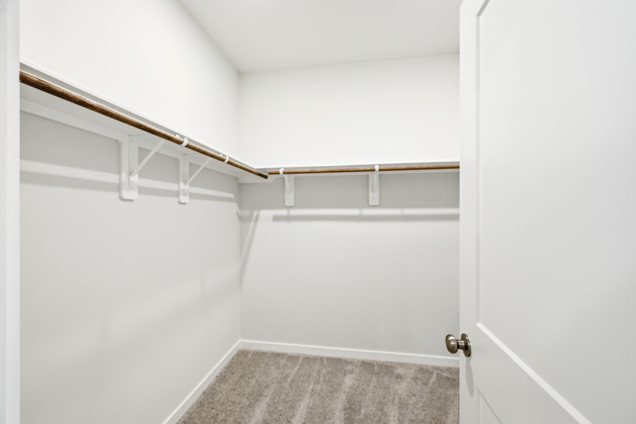 A white room with a white door.