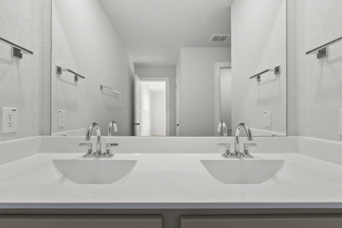 A bathroom with two sinks.
