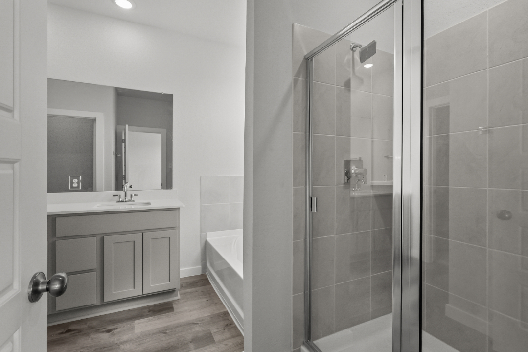 A bathroom with a glass shower.