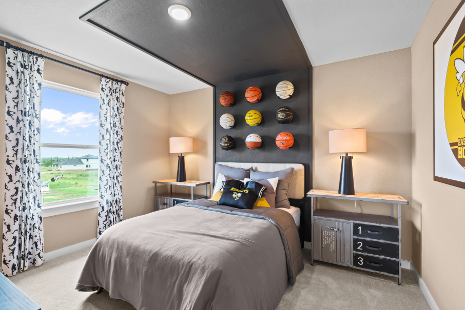 A bedroom with a large window.