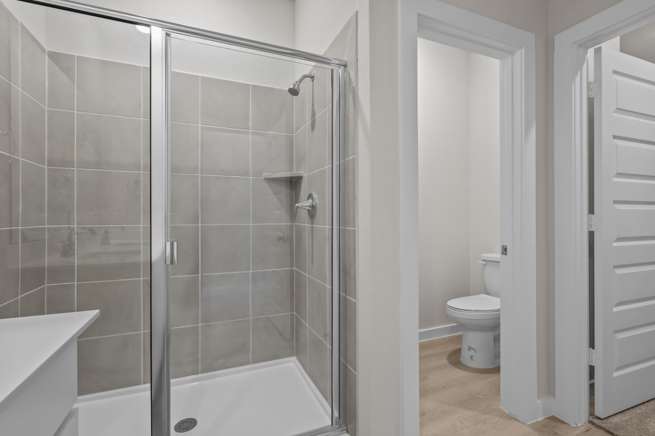 A bathroom with a glass shower.