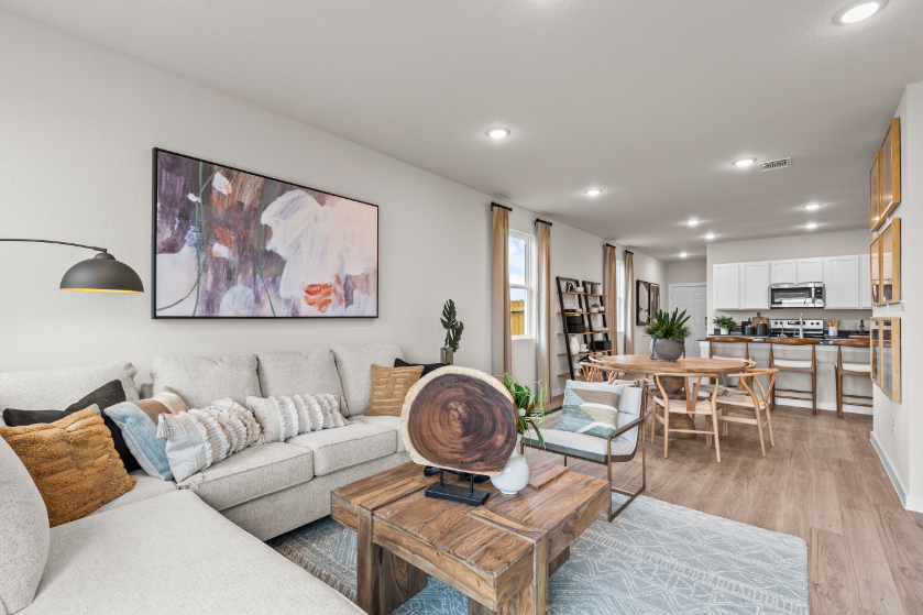 A living room with a wood floor.
