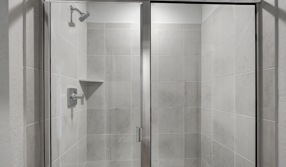 A shower with a glass door.