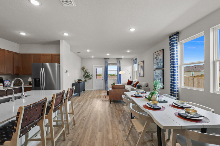A kitchen with a dining table.