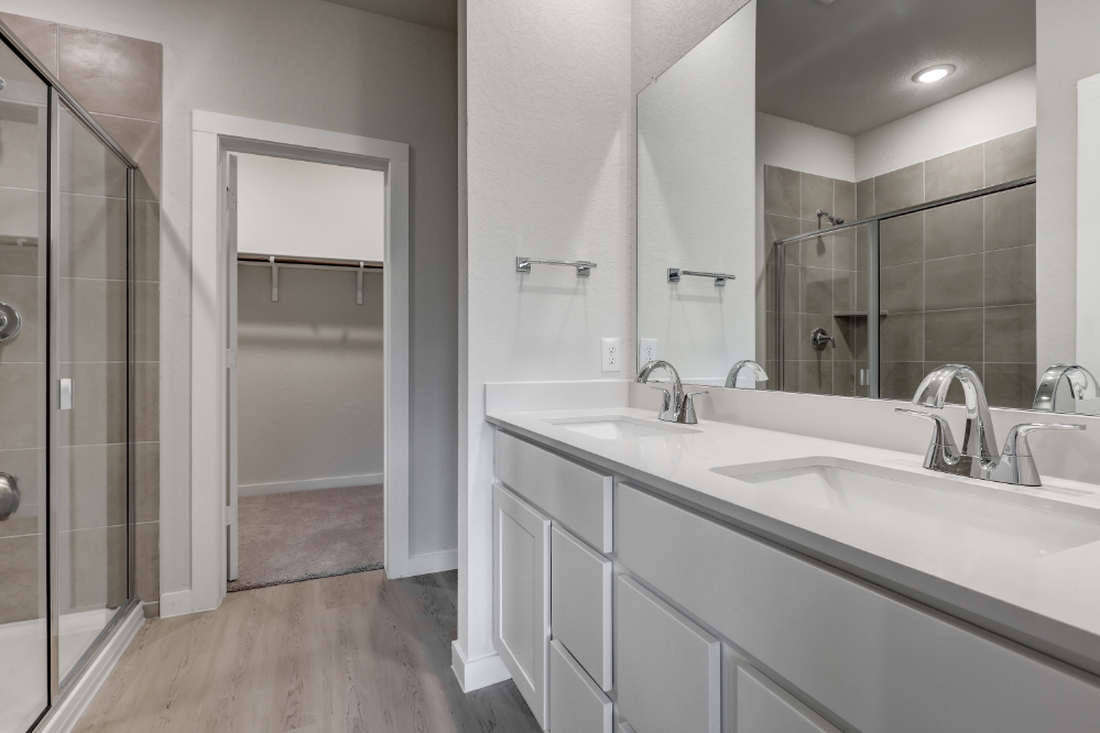 A bathroom with a glass shower.