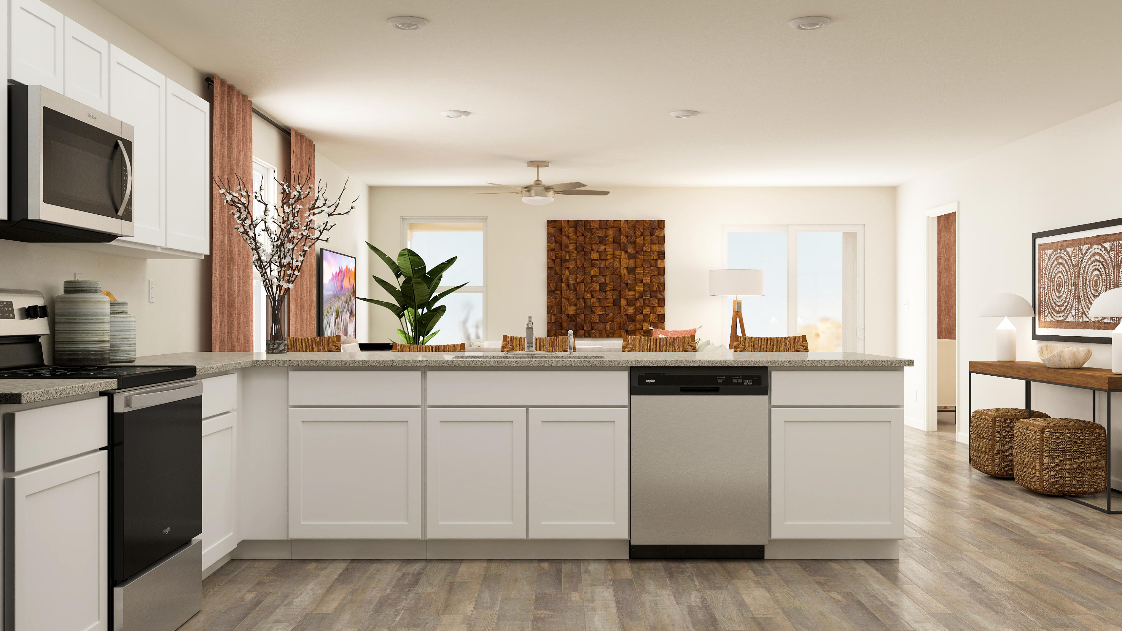 A kitchen with white cabinets.
