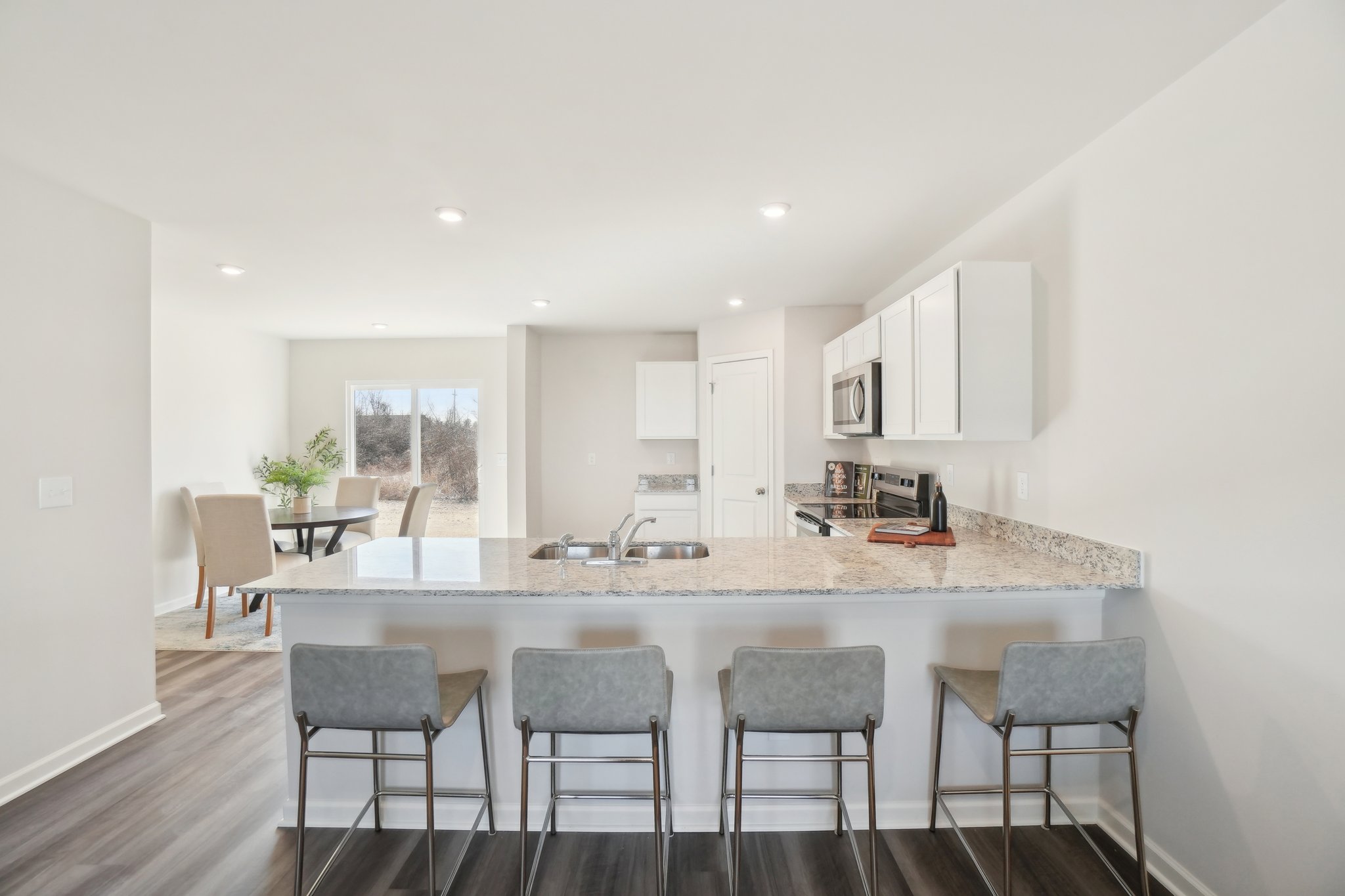 A kitchen with a marble island.
