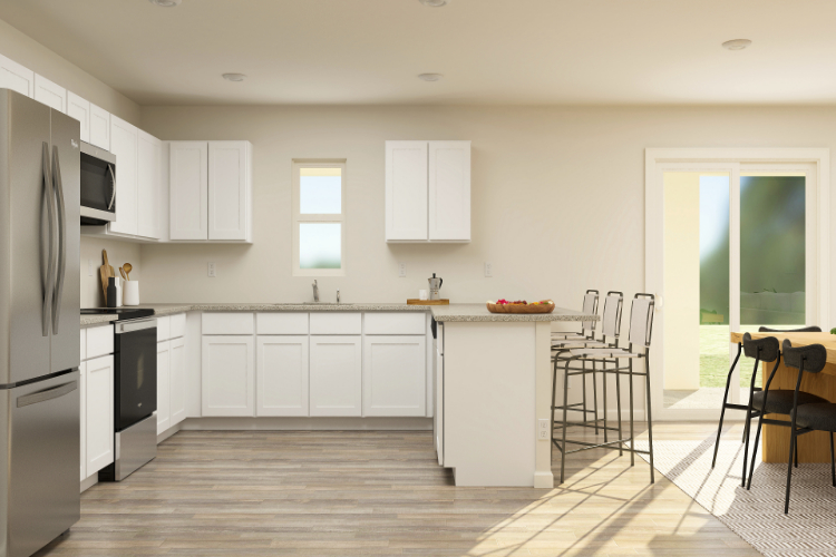 A kitchen with white cabinets.