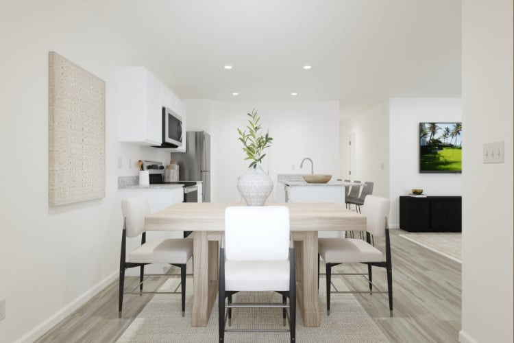 A dining room with a table and chairs.