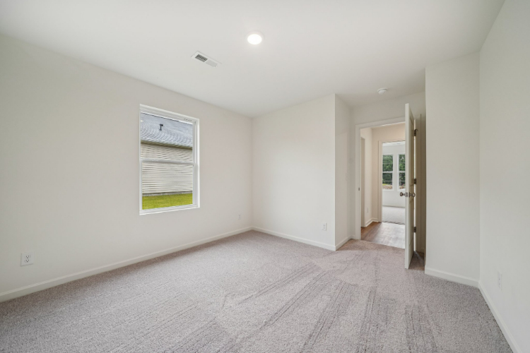 A hallway with white walls.