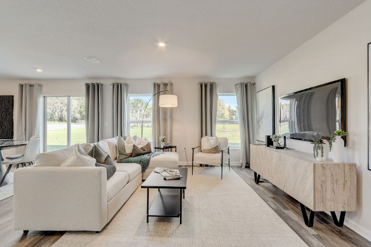 A living room with a large mirror.