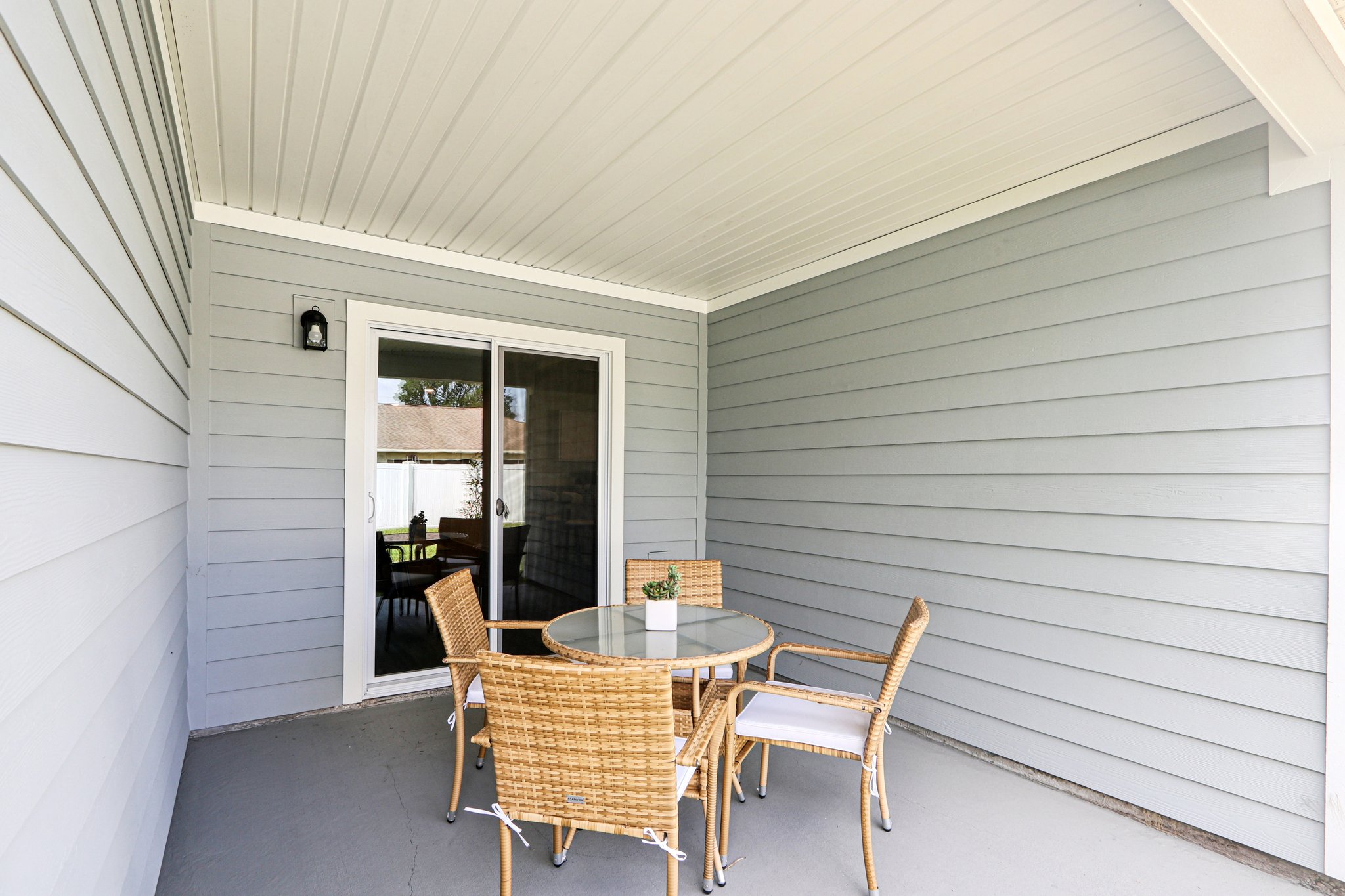 A dining room with a table and chairs.